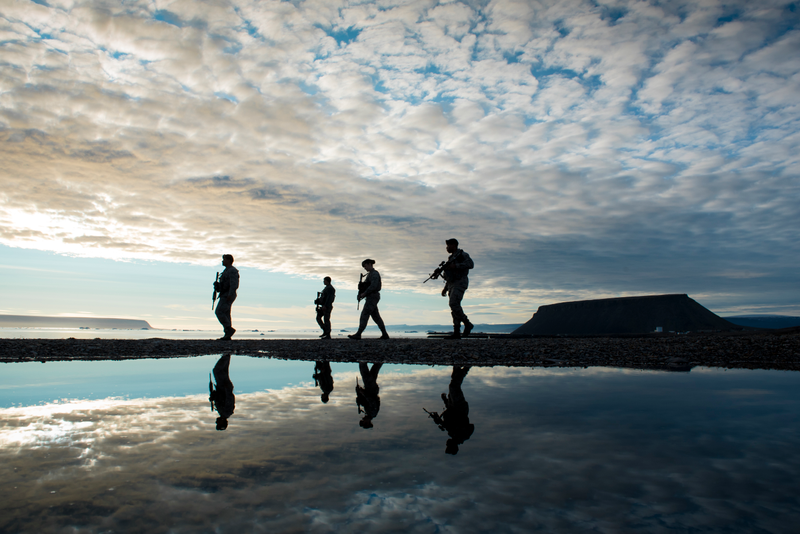 821st Security Forces Squadron members, walk back to their vehicle after responding to a training exercise at Thule Air Base, Greenland, Aug. 16, 2018.